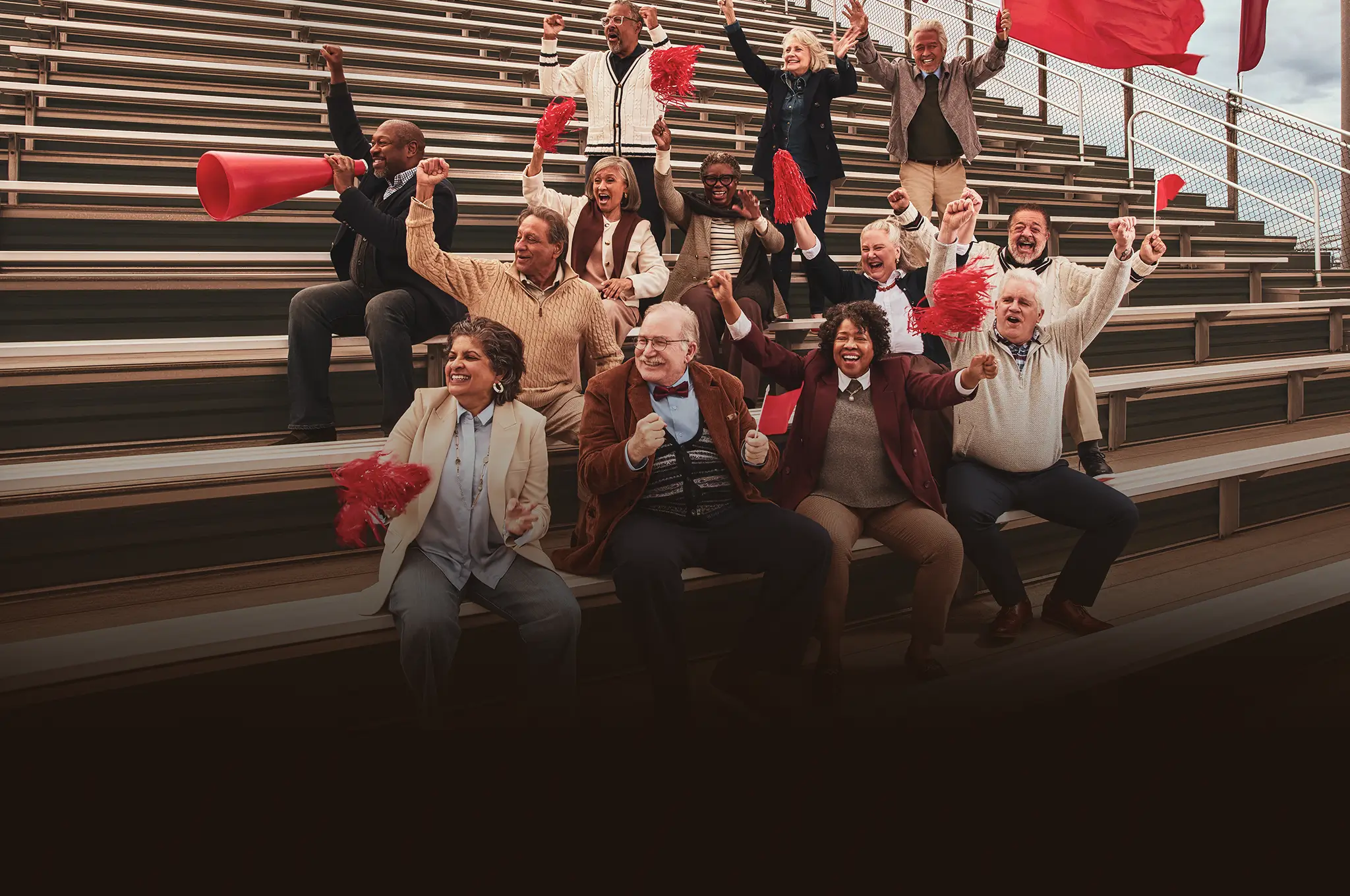 A group of older adults cheering on gym bleachers. A green banner reads “mNEXSPIKE demonstrated a robust immune response”